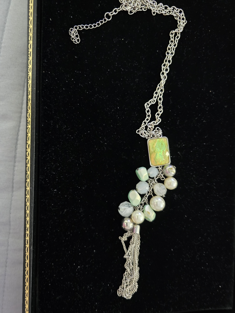 Silver Tassel Pendant Necklace with Iridescent Green Accent
